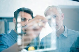 Two Hatch employees identifying, assessing, and mitigating risks to ensure the project objectives are met.